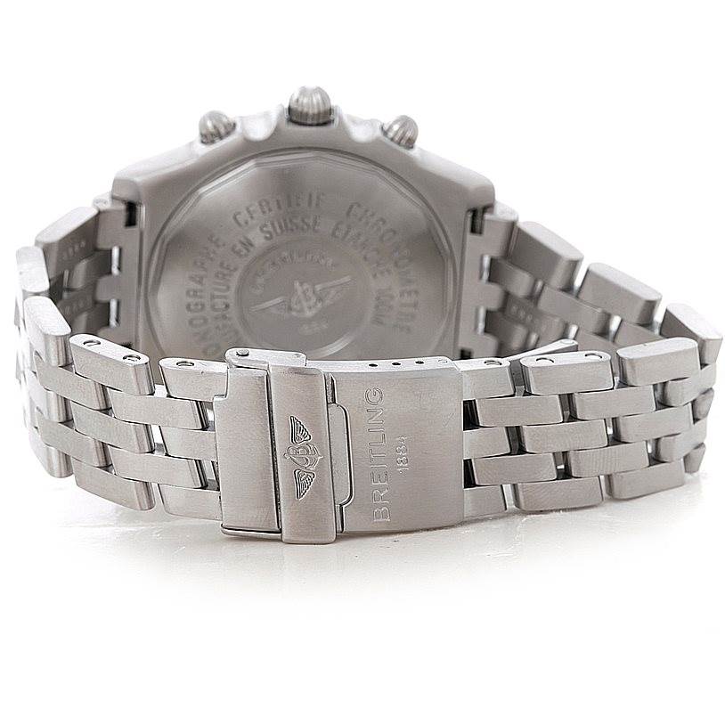 The image shows the back case and clasp of a Breitling Windrider A13355 Men's Stainless Steel Silver Dial A13355 Men's Stainless Steel Silver Dial watch at an angle that highlights the metal bracelet and engraved details.