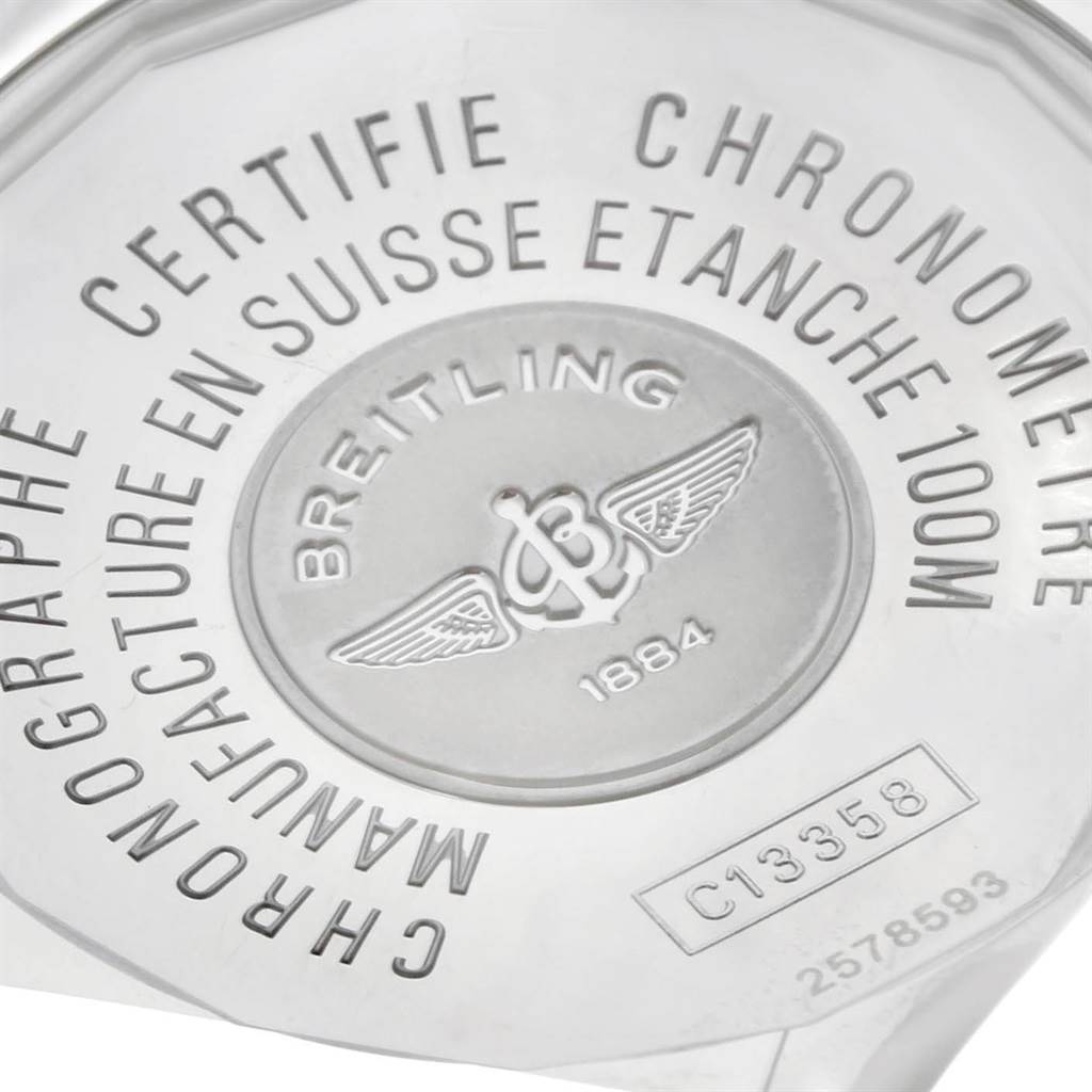 The image shows the back case of a Breitling Windrider C13358 Steel and Gold (two tone) Mother of Pearl Dial C13358 Steel and Gold (two tone) Mother of Pearl Dial watch, highlighting engravings and the brand's logo.