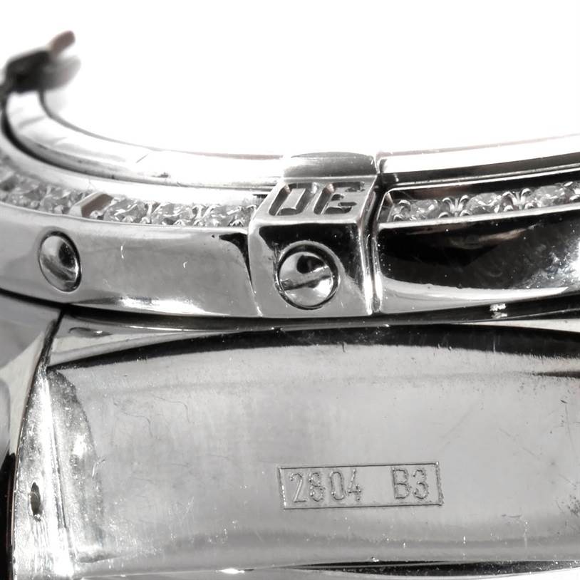 The image shows a close-up view of the bezel and part of the caseback of a Breitling Windrider A13358 Stainless Steel Mother of Pearl Dial A13358 Stainless Steel Mother of Pearl Dial watch.
