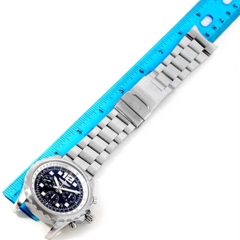 The image shows a top-down view of the Breitling Professional Series A23360 Men
s Stainless Steel Black Dial A23360 Men
s Stainless Steel Black Dial watch, highlighting the face, band, and clasp next to a ruler.