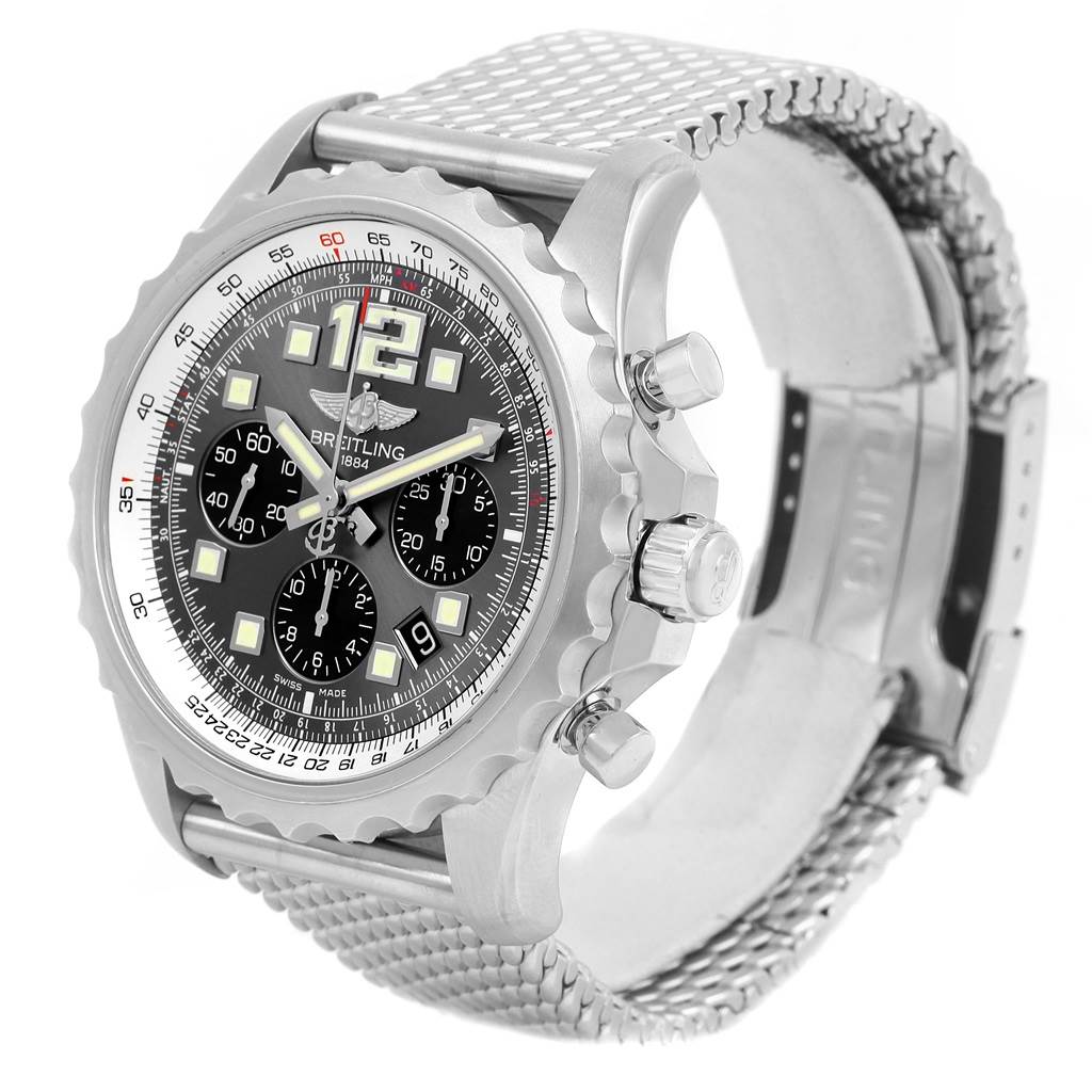 The Professional Series Breitling watch is shown at an angled view highlighting the face, bezel, crown, push buttons, and metal mesh band.
