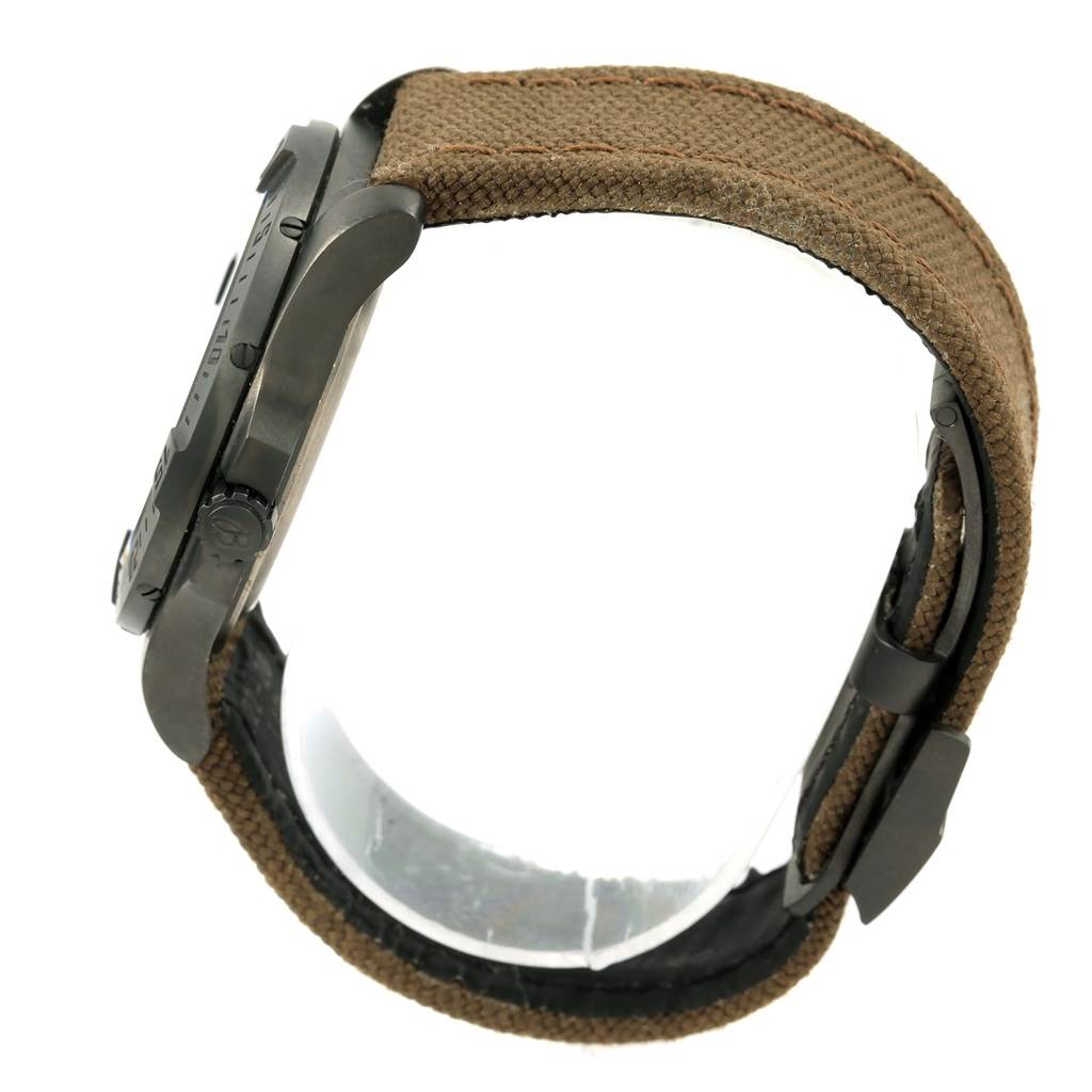 The image shows a side view of the Breitling Professional Series E56062 Men's Titanium Grey Dial E56062 Men's Titanium Grey Dial watch highlighting the case, crown, and brown fabric strap.