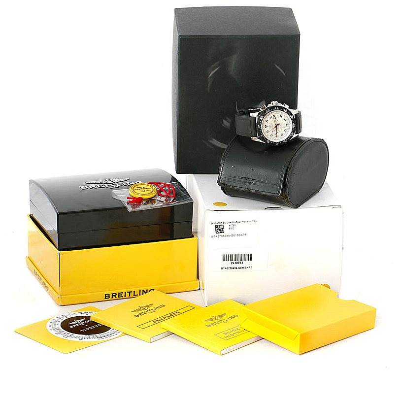 The image shows a Breitling Professional Series A27364 Men's Stainless Steel Silver Dial A27364 Men's Stainless Steel Silver Dial watch along with its packaging, manuals, and certification documents.