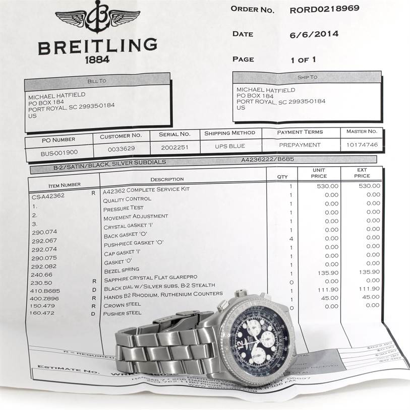 The image shows a Breitling Professional Series A42362 Men's Stainless Steel Grey Dial A42362 Men's Stainless Steel Grey Dial watch, angled to reveal its bracelet and face, placed on top of an invoice.