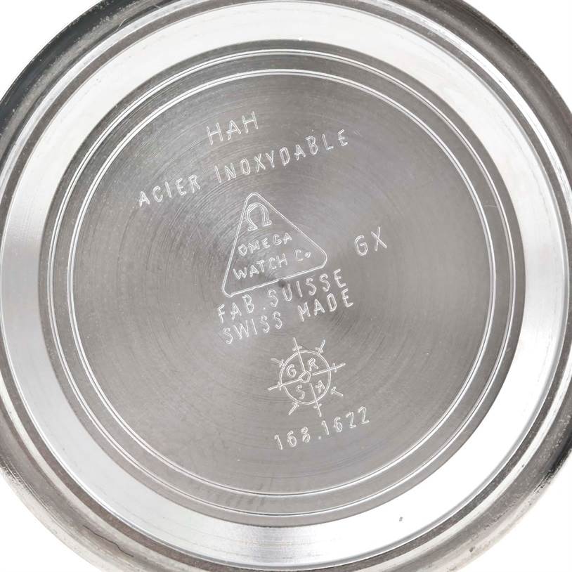 The image shows the inner case back of an Omega Seamaster 2551.80.00 Men
s Stainless Steel Blue Dial 2551.80.00 Men
s Stainless Steel Blue Dial watch, displaying various engravings and markings.