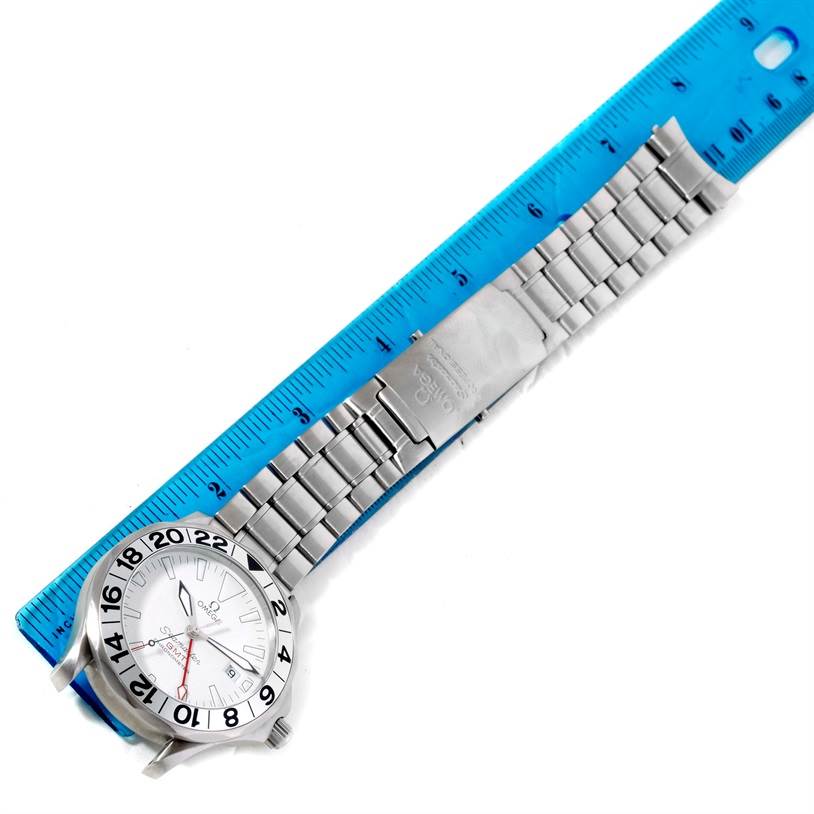 The Omega Seamaster 2538.20.00 Men
s Stainless Steel White Dial 2538.20.00 Men
s Stainless Steel White Dial watch is shown flat, face-up, with the bracelet extended and measured against a ruler.