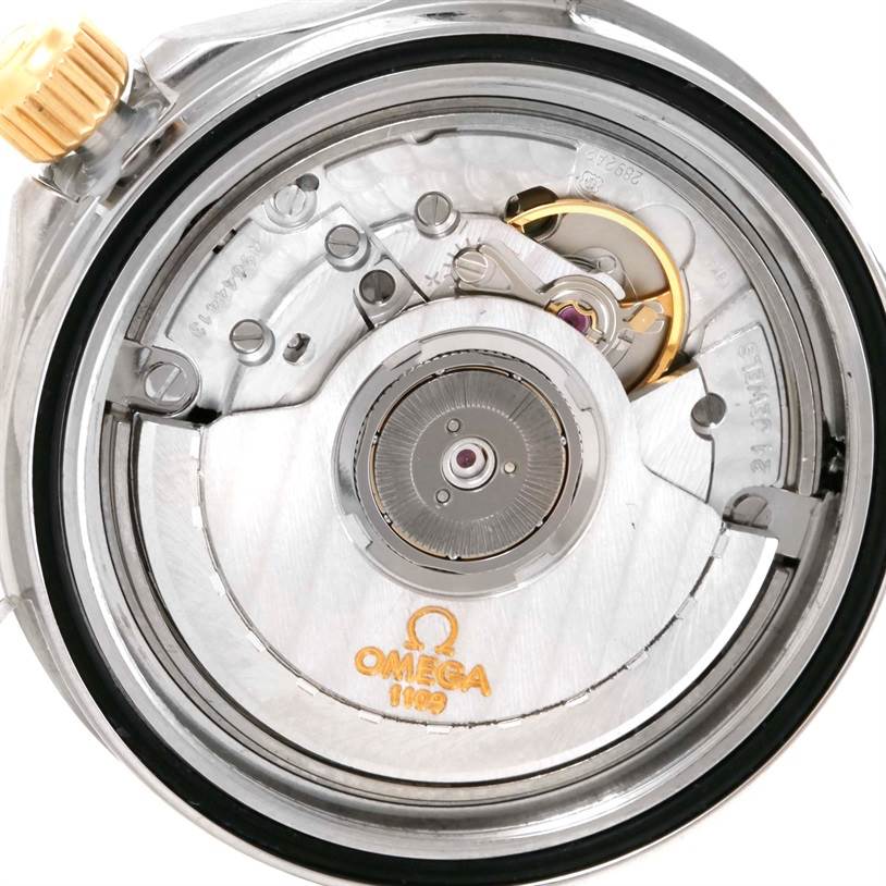 This image shows a close-up of the movement mechanism of the Omega Seamaster Men's Steel and Gold (two tone) White Dial Men's Steel and Gold (two tone) White Dial watch.