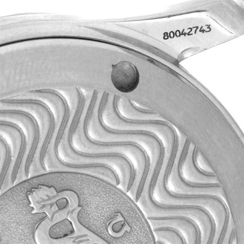 This image shows a close-up of the case back of an Omega Seamaster Men's Steel and Gold (two tone) White Dial Men's Steel and Gold (two tone) White Dial watch with serial number details visible.