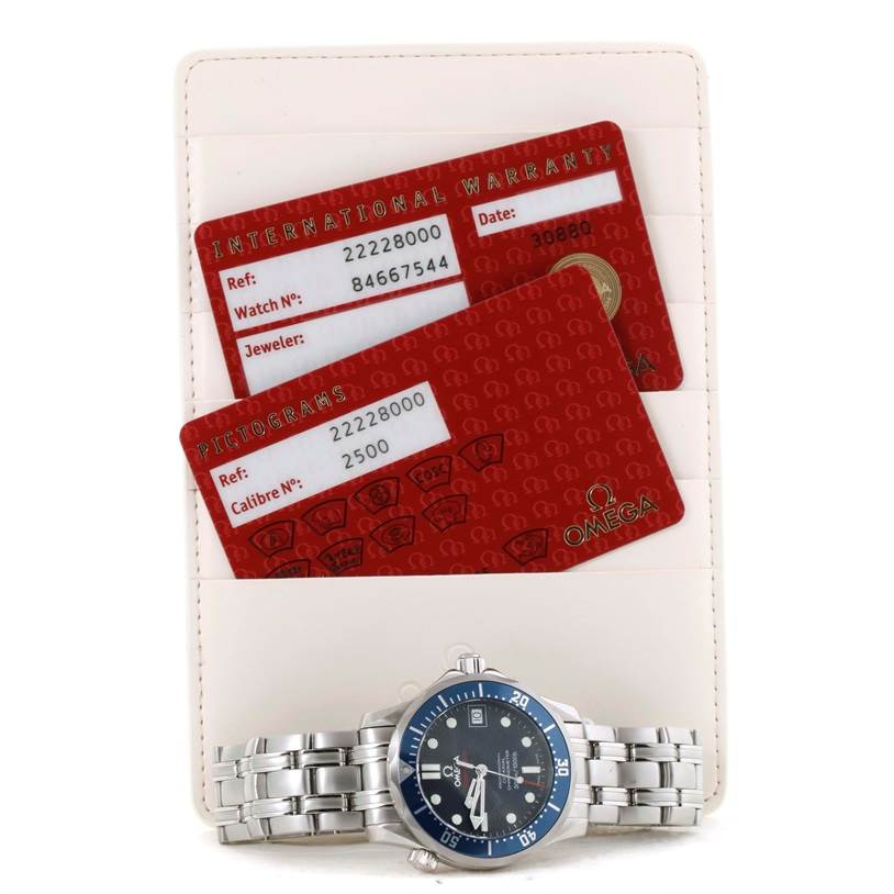 The image shows an Omega Seamaster 2222.80.00 Men
s Stainless Steel Blue Dial 2222.80.00 Men
s Stainless Steel Blue Dial watch with a blue dial and two warranty cards placed on a cardholder.
