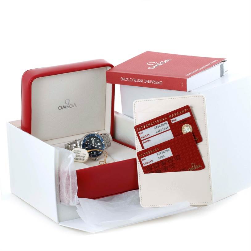 The image shows an Omega Seamaster 2222.80.00 Men
s Stainless Steel Blue Dial 2222.80.00 Men
s Stainless Steel Blue Dial watch from a top angle, including its box, warranty cards, and operating instructions.