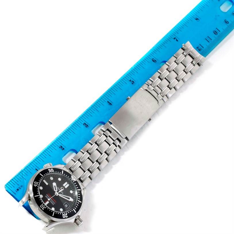 This image shows the Omega Seamaster 212.30.36.61.01.001 Men
s Stainless Steel Black Dial 212.30.36.61.01.001 Men
s Stainless Steel Black Dial watch from an overhead angle with its bracelet and buckle alongside a ruler for scale.