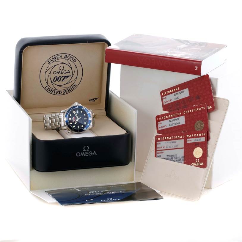 The image shows an Omega Seamaster 2226.80.00 Men
s Stainless Steel Blue Dial 2226.80.00 Men
s Stainless Steel Blue Dial watch in a display box, accompanied by warranty cards, booklets, and a cardholder.