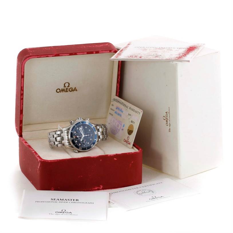 The Omega Seamaster 2599.80.00 Men
s Stainless Steel Blue Dial 2599.80.00 Men
s Stainless Steel Blue Dial watch is shown at a frontal angle with its red case, warranty card, and accompanying documentation.