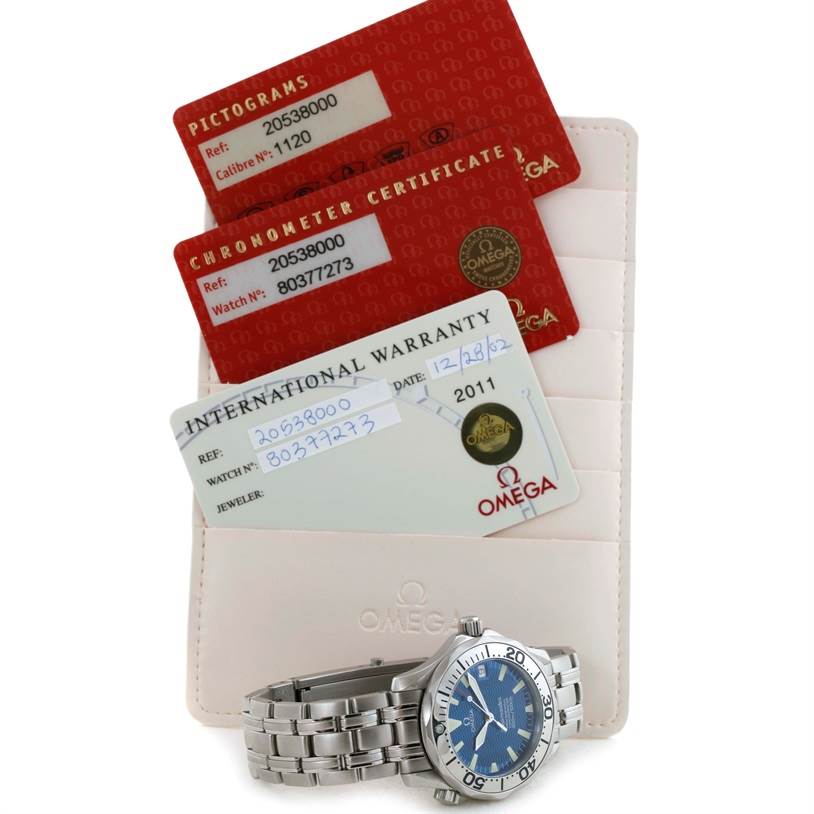 The image shows an Omega Seamaster 2053.80.00 Men
s Stainless Steel Blue Dial 2053.80.00 Men
s Stainless Steel Blue Dial watch with its international warranty, pictograms, and chronometer certificate cards.