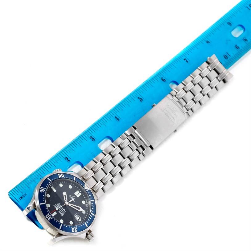 The image shows an Omega Seamaster 2531.80.00 Men
s Stainless Steel Blue Dial 2531.80.00 Men
s Stainless Steel Blue Dial watch laid flat next to a blue ruler, displaying the watch face and stainless steel bracelet.