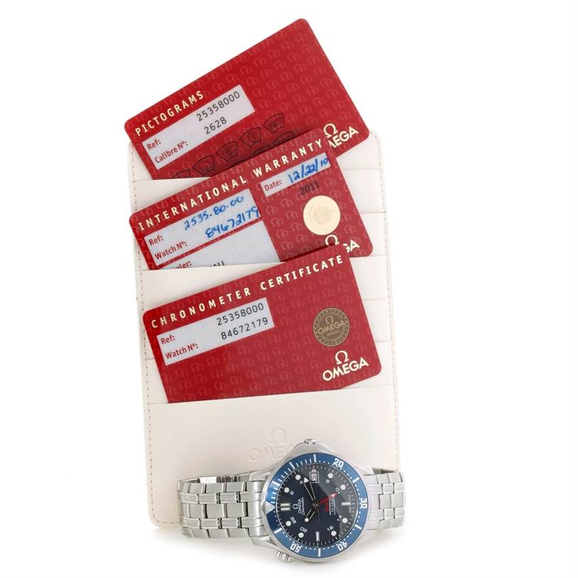 The image shows the Omega Seamaster 2535.80.00 Men
s Stainless Steel Blue Dial 2535.80.00 Men
s Stainless Steel Blue Dial watch along with its warranty cards and certificate, angled from above.
