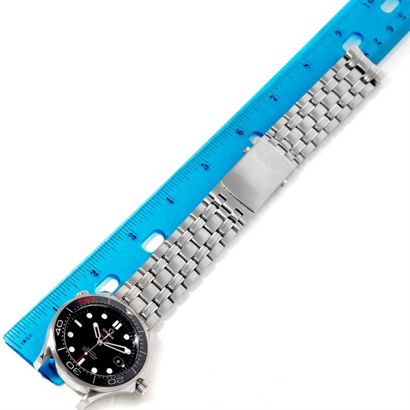 The image shows an Omega Seamaster 212.30.41.20.01.005 Men
s Stainless Steel Black Dial 212.30.41.20.01.005 Men
s Stainless Steel Black Dial watch and bracelet laid flat next to a blue ruler.