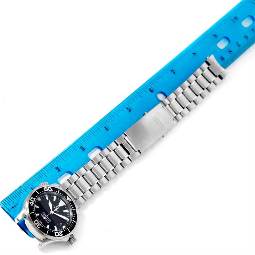 The image shows an Omega Seamaster 2262.50.00 Men
s Stainless Steel Black Dial 2262.50.00 Men
s Stainless Steel Black Dial watch laid flat with a blue ruler, highlighting the stainless steel bracelet and black dial.