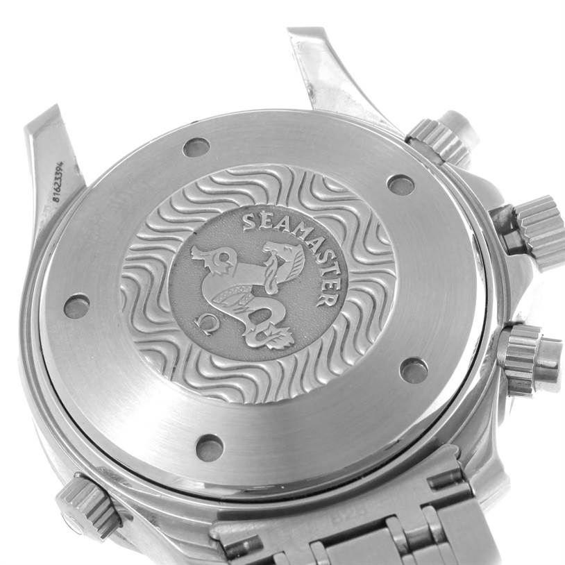 The image shows the case back of an Omega Seamaster 2599.80.00 Men
s Stainless Steel Blue Dial 2599.80.00 Men
s Stainless Steel Blue Dial watch, highlighting the engraved emblem and the stainless steel bracelet.