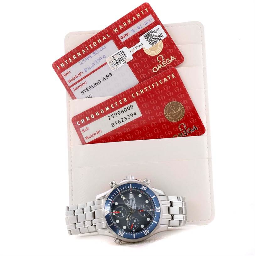 The image shows an Omega Seamaster 2599.80.00 Men
s Stainless Steel Blue Dial 2599.80.00 Men
s Stainless Steel Blue Dial watch, front-facing, with its international warranty and chronometer certificate cards.