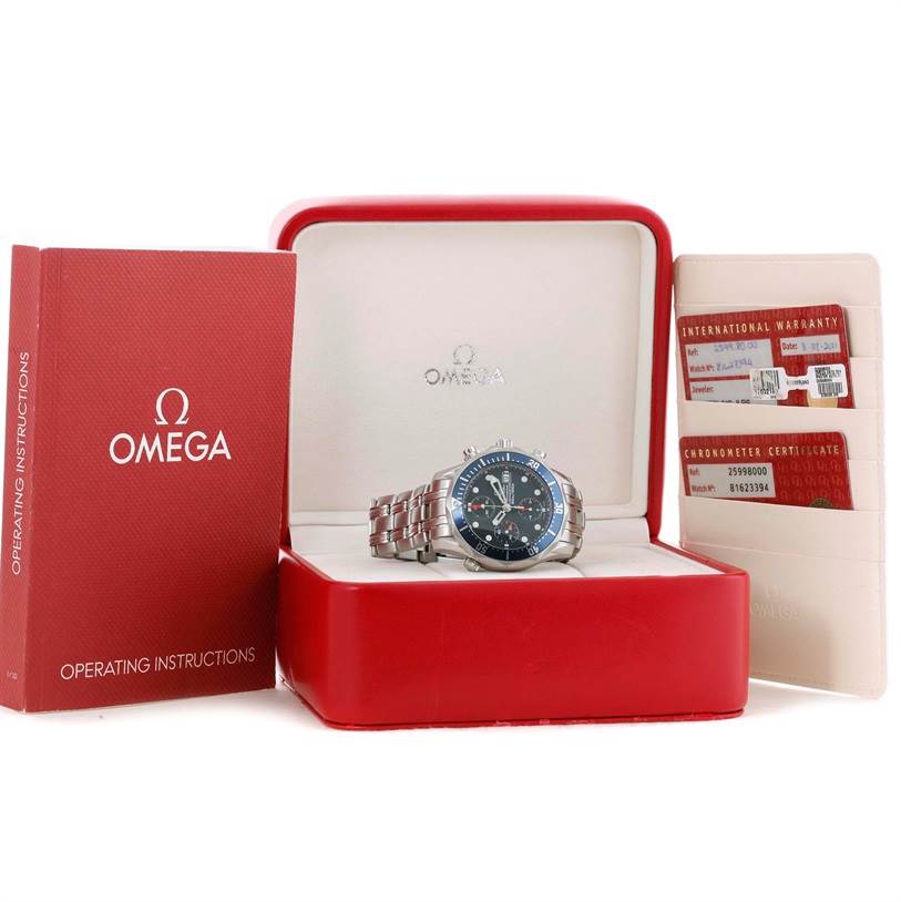 The image shows an Omega Seamaster 2599.80.00 Men
s Stainless Steel Blue Dial 2599.80.00 Men
s Stainless Steel Blue Dial watch in its box, accompanied by an operating instructions booklet and warranty cards.