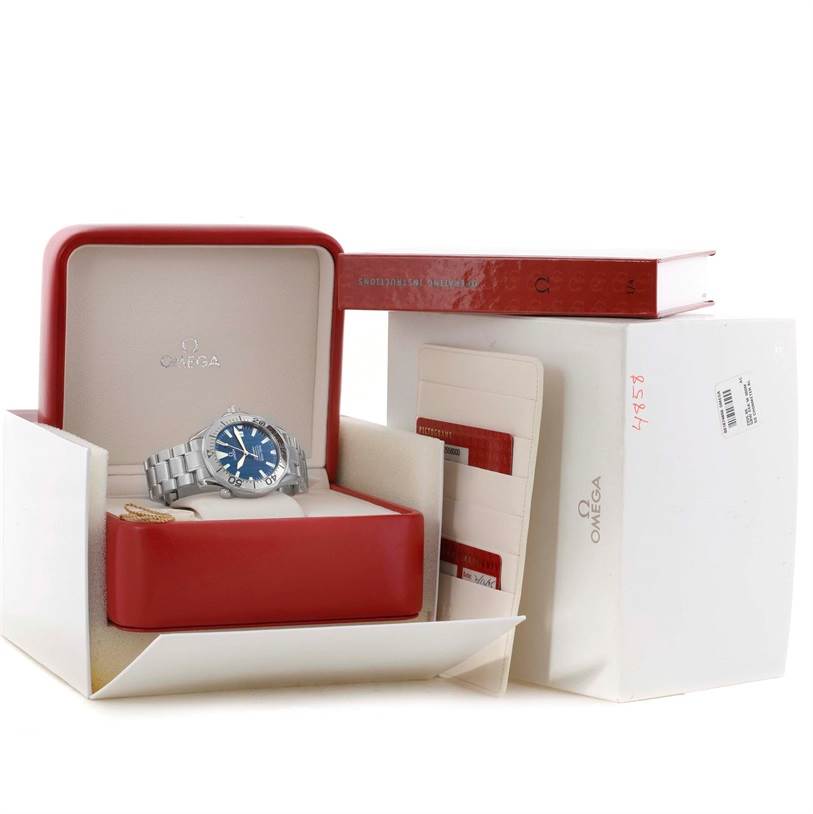 The Omega Seamaster 2255.80.00 Men
s Stainless Steel Blue Dial 2255.80.00 Men
s Stainless Steel Blue Dial watch is displayed at a slight angle in its open red box, with accompanying cards and a book.