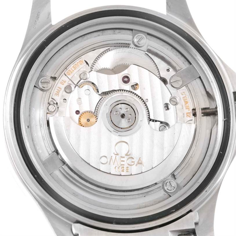 The image shows the back of an Omega Seamaster 2538.20.00 Men
s Stainless Steel White Dial 2538.20.00 Men
s Stainless Steel White Dial watch, highlighting its intricate internal mechanical movements.