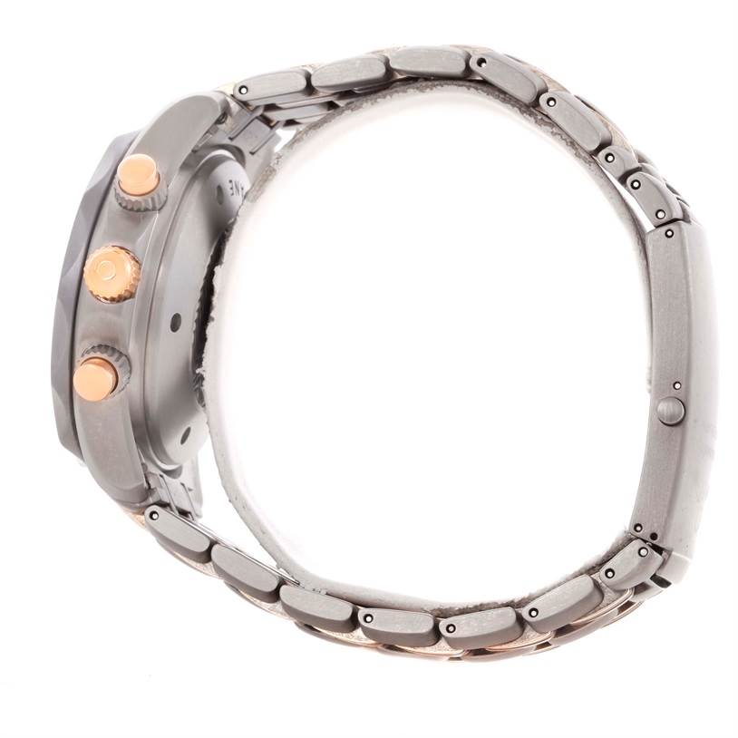 The image shows a side view of an Omega Seamaster 2296.80.00 Men's Titanium Blue Dial 2296.80.00 Men's Titanium Blue Dial watch, highlighting the crown, pushers, and metal bracelet.