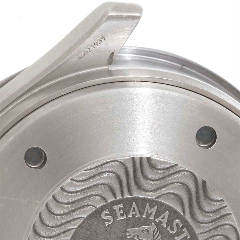 This image shows a close-up of the case back and part of the bezel of an Omega Seamaster 2296.80.00 Men's Titanium Blue Dial 2296.80.00 Men's Titanium Blue Dial watch, focusing on the engraved logo and serial number.