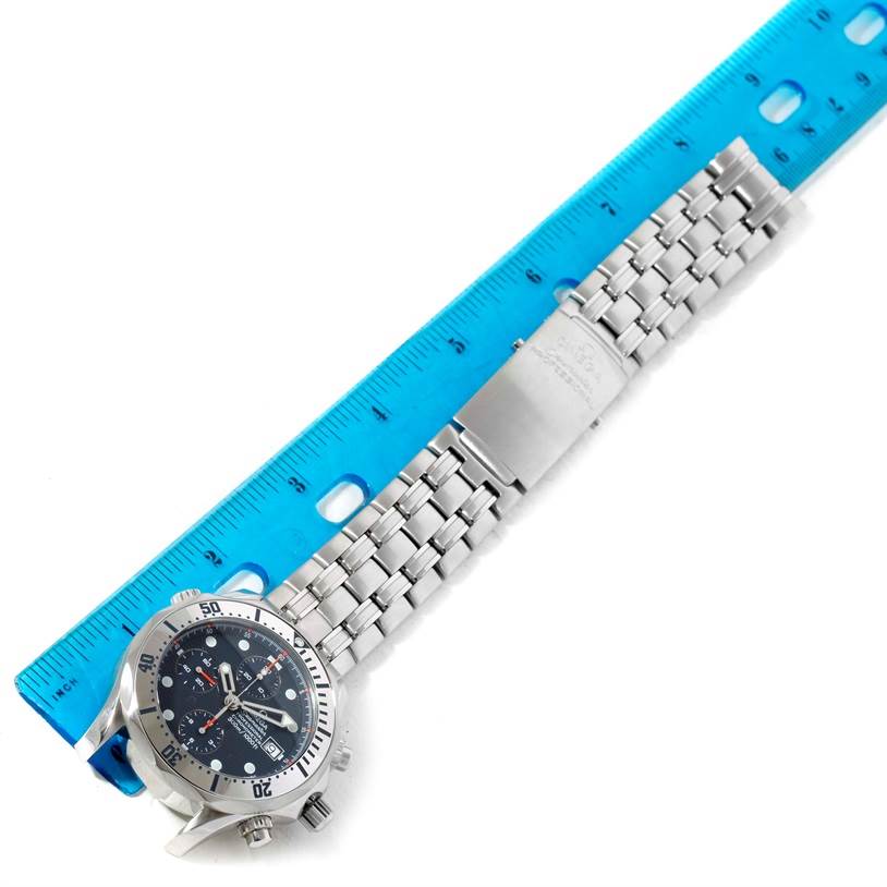 The Omega Seamaster 2598.80.00 Men
s Stainless Steel Blue Dial 2598.80.00 Men
s Stainless Steel Blue Dial watch is shown flat with its face, bezel, and metal bracelet alongside a ruler.