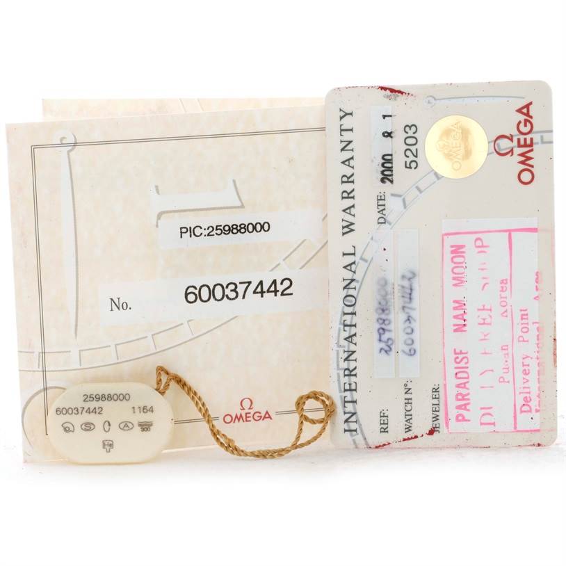 The image shows International Warranty cards and tags for the Omega Seamaster 2598.80.00 Men
s Stainless Steel Blue Dial 2598.80.00 Men
s Stainless Steel Blue Dial watch model.