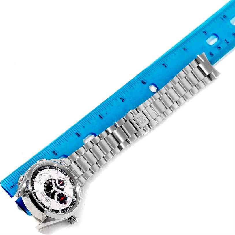 The Omega Seamaster 2513.30.00 Men
s Stainless Steel Silver Dial 2513.30.00 Men
s Stainless Steel Silver Dial watch is shown laying flat with its face, bezel, and metal bracelet measured against a blue ruler.