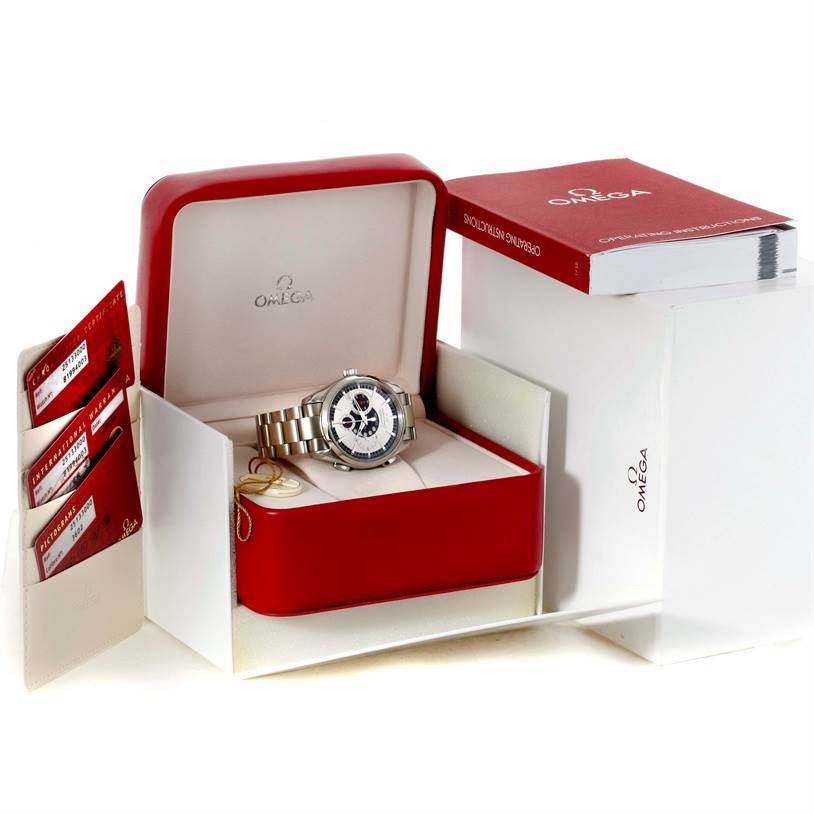 The image shows an Omega Seamaster 2513.30.00 Men
s Stainless Steel Silver Dial 2513.30.00 Men
s Stainless Steel Silver Dial watch in its open box with accompanying accessories, including a manual and warranty cards.