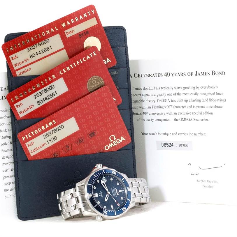 The image shows an Omega Seamaster 2537.80.00 Men
s Stainless Steel Blue Dial 2537.80.00 Men
s Stainless Steel Blue Dial watch positioned next to its warranty cards, certificates, and documentation.