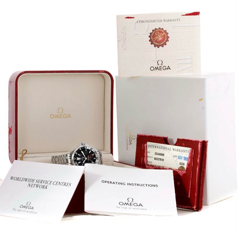 The image shows an Omega Seamaster 2534.50.00 Men
s Stainless Steel Black Dial 2534.50.00 Men
s Stainless Steel Black Dial watch with its box, warranty card, and instruction manuals.