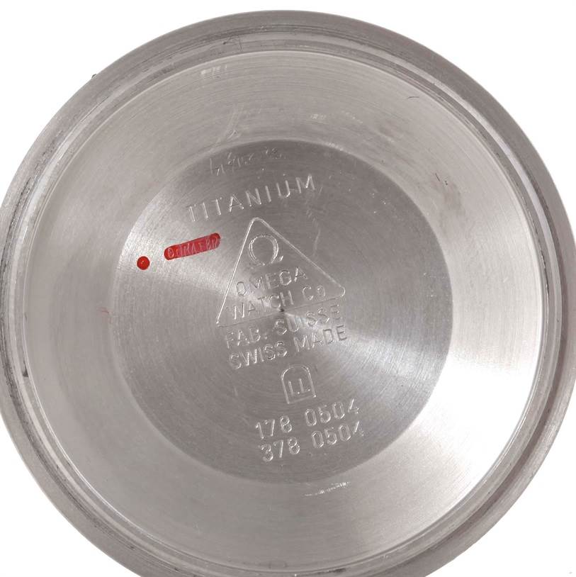 The image shows the inner case back of an Omega Seamaster 2298.80.00 Men's Titanium Blue Dial 2298.80.00 Men's Titanium Blue Dial watch, displaying engraved details including "Titanium" and "Swiss Made."