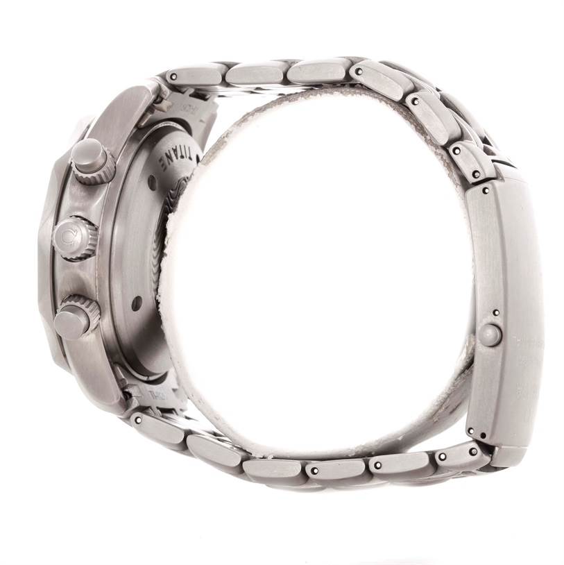 The image shows a side view of an Omega Seamaster 2298.80.00 Men's Titanium Blue Dial 2298.80.00 Men's Titanium Blue Dial watch, highlighting the crown, pushers, and metal bracelet.