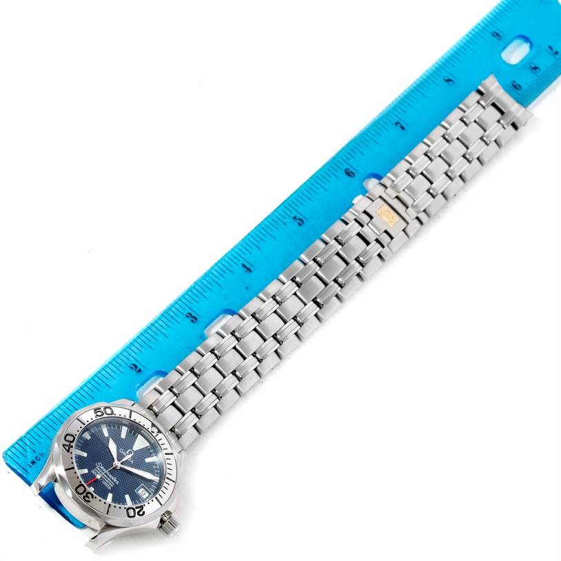 The image shows the Omega Seamaster 2053.80.00 Men
s Stainless Steel Blue Dial 2053.80.00 Men
s Stainless Steel Blue Dial watch laid flat with a ruler measuring the length of its metal bracelet.