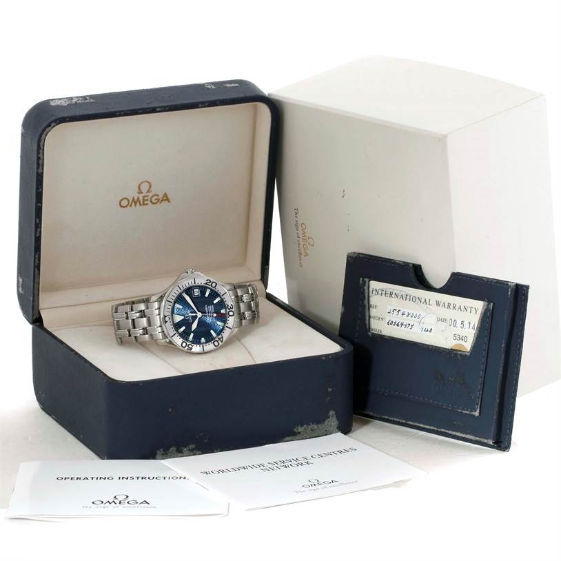 The Omega Seamaster 2053.80.00 Men
s Stainless Steel Blue Dial 2053.80.00 Men
s Stainless Steel Blue Dial watch is shown in its box along with operating instructions and an international warranty card.