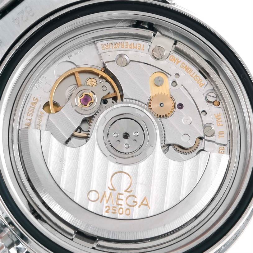 The image shows a close-up of the Omega Seamaster 2222.80.00 Men
s Stainless Steel Blue Dial 2222.80.00 Men
s Stainless Steel Blue Dial watch
s movement mechanism, specifically the Omega 2500 Co-Axial caliber.