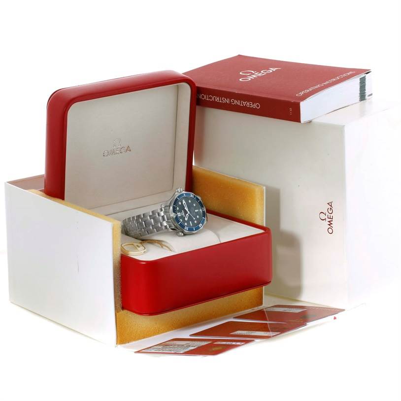 The Omega Seamaster 2222.80.00 Men
s Stainless Steel Blue Dial 2222.80.00 Men
s Stainless Steel Blue Dial watch is shown in its red and white box, along with operating instructions and warranty cards.