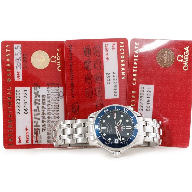 The Omega Seamaster 2222.80.00 Men
s Stainless Steel Blue Dial 2222.80.00 Men
s Stainless Steel Blue Dial watch is displayed flat with its face and stainless steel bracelet visible, alongside warranty and pictogram cards.