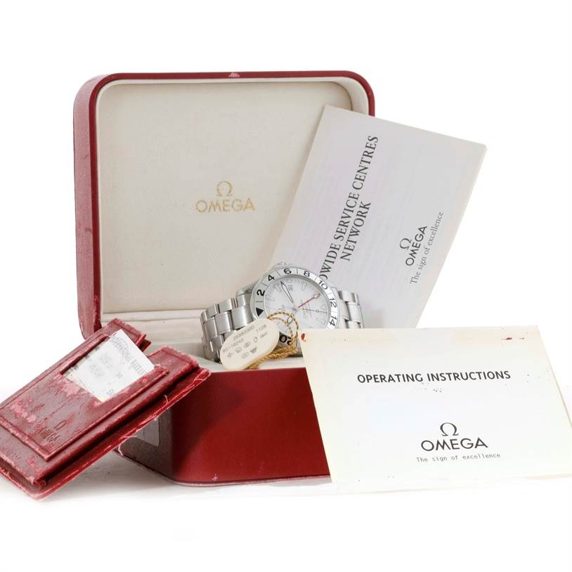 The image shows an Omega Seamaster 2538.20.00 Men
s Stainless Steel White Dial 2538.20.00 Men
s Stainless Steel White Dial watch with its original box, warranty card, and operating instructions booklet.