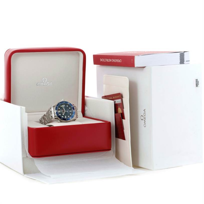 The Omega Seamaster 2222.80.00 Men
s Stainless Steel Blue Dial 2222.80.00 Men
s Stainless Steel Blue Dial watch is displayed in its open box at a three-quarter angle, along with manuals and warranty cards.