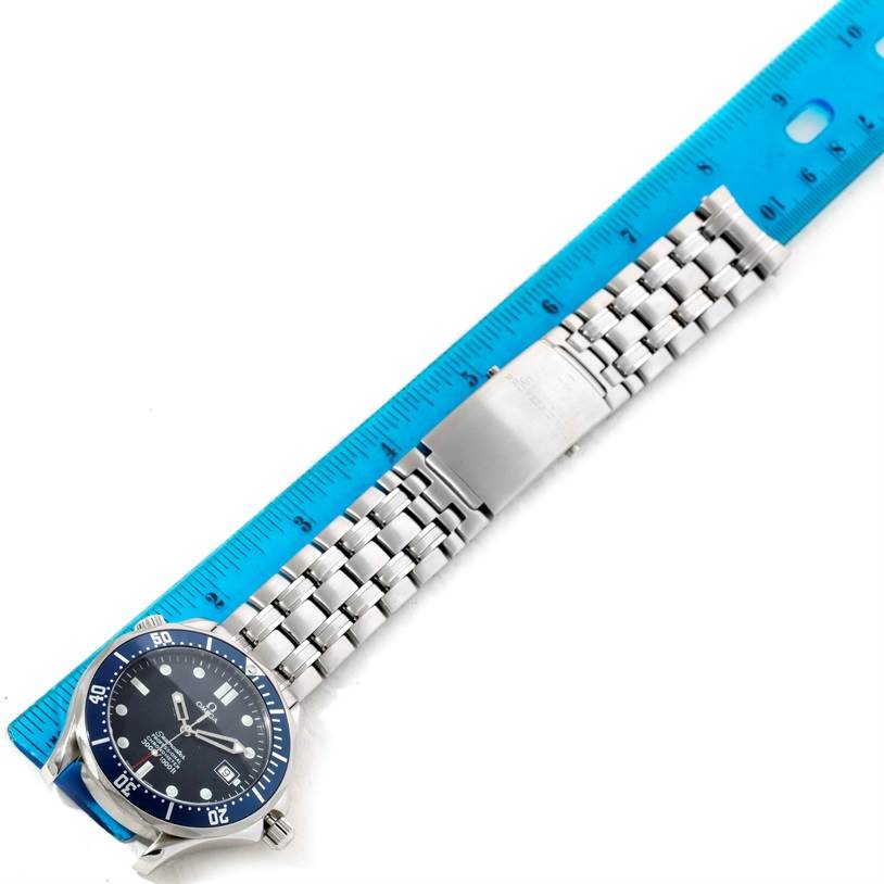 The Omega Seamaster 2531.80.00 Men
s Stainless Steel Blue Dial 2531.80.00 Men
s Stainless Steel Blue Dial watch is shown flat with its face, bracelet, and clasp visible next to a blue ruler for scale.