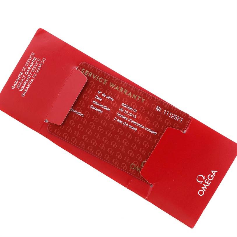 The image shows the service warranty card and red envelope for the Omega Seamaster 2531.80.00 Men
s Stainless Steel Blue Dial 2531.80.00 Men
s Stainless Steel Blue Dial watch.