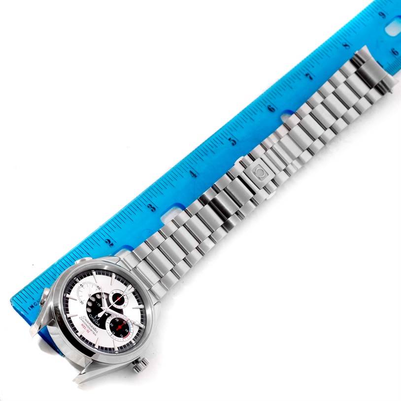 The Omega Seamaster 2513.30.00 Men
s Stainless Steel Silver Dial 2513.30.00 Men
s Stainless Steel Silver Dial watch is positioned flat next to a ruler, showing its face and full metal strap.