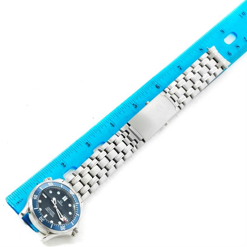 The Omega Seamaster 2561.80.00 Men
s Stainless Steel Blue Dial 2561.80.00 Men
s Stainless Steel Blue Dial watch is shown from the top, including the bracelet and clasp, with a blue ruler measuring its length.