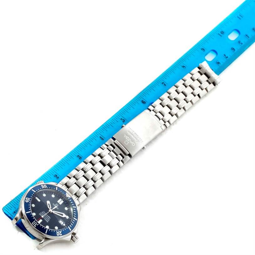 The image shows an Omega Seamaster 2531.80.00 Men
s Stainless Steel Blue Dial 2531.80.00 Men
s Stainless Steel Blue Dial watch laid flat next to a blue ruler, displaying the face, bracelet, and clasp.