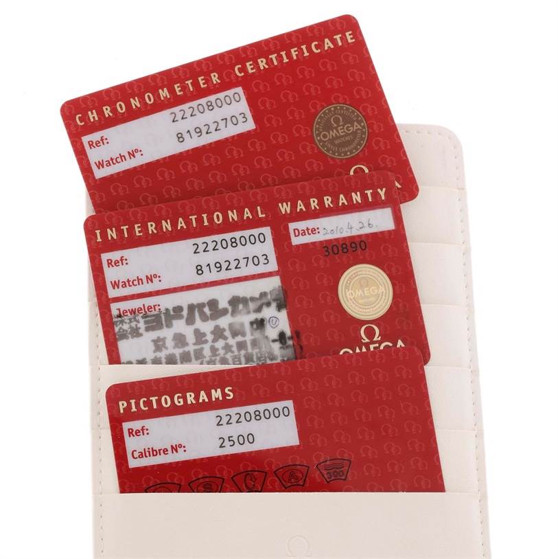 The image shows the Chronometer Certificate, International Warranty, and Pictograms cards for an Omega Seamaster 2220.80.00 Men
s Stainless Steel Blue Dial 2220.80.00 Men
s Stainless Steel Blue Dial watch.